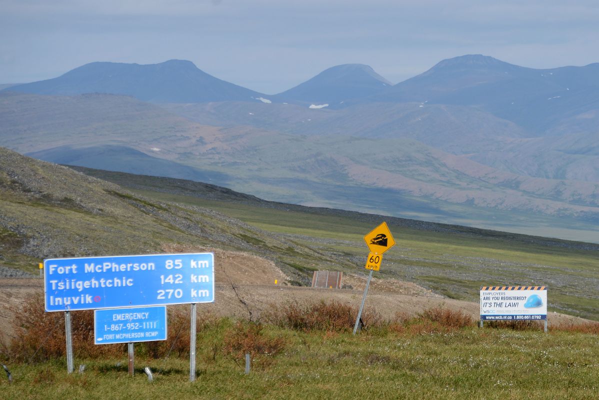 19C Dempster Highway Sign Fort McPherson 85km, Tsiigehtchic 142km, Inuvik 270km At The Northwest Territories Yukon Border On Day Tour From Inuvik To Arctic Circle